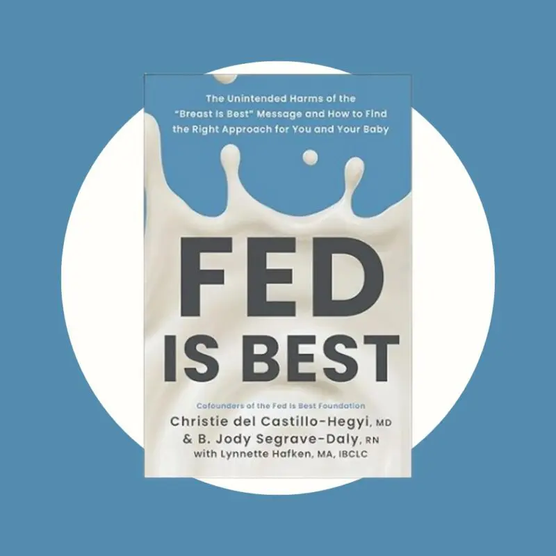 blue book with milk coming out of it and titled fed is best