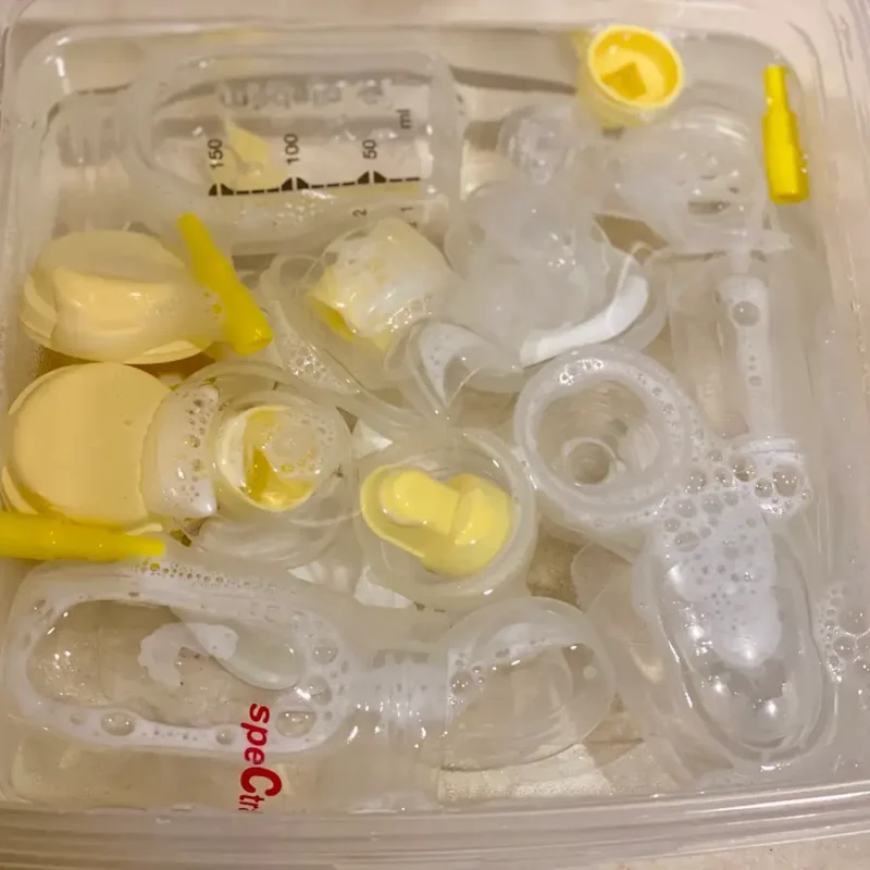 A plastic container filled with yellow and white objects.