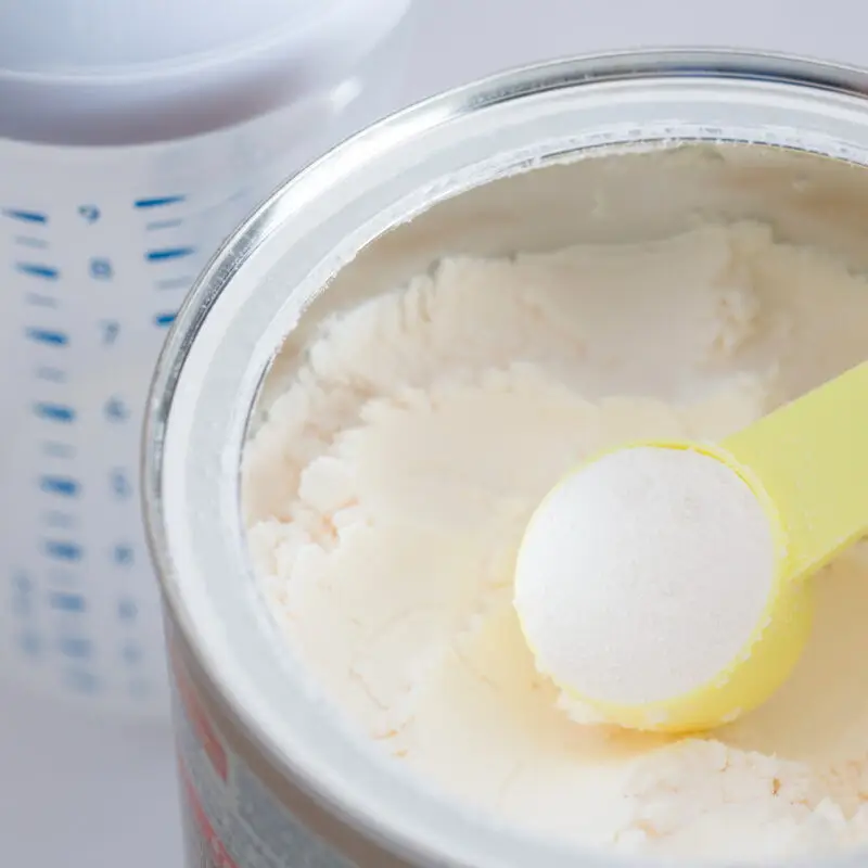 A spoon in a can of ice cream.