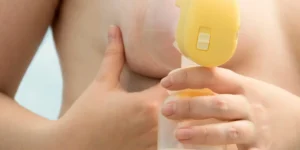 Breastfeeding pump in use by a person.