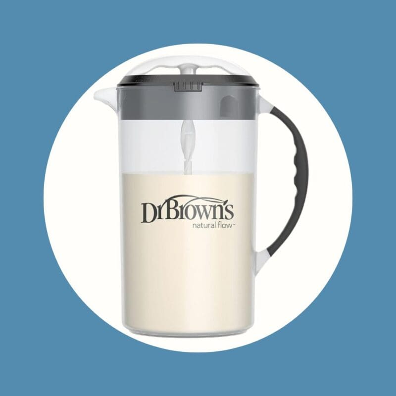 clear pitcher with dark lid and handle filled with white substance and labeled dr. brown's