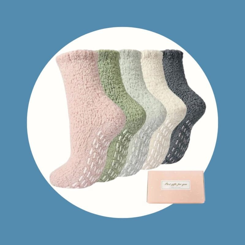 fluffy socks in colors pink, green, grey, cream, and dark grey with non-slip pads on the bottoms