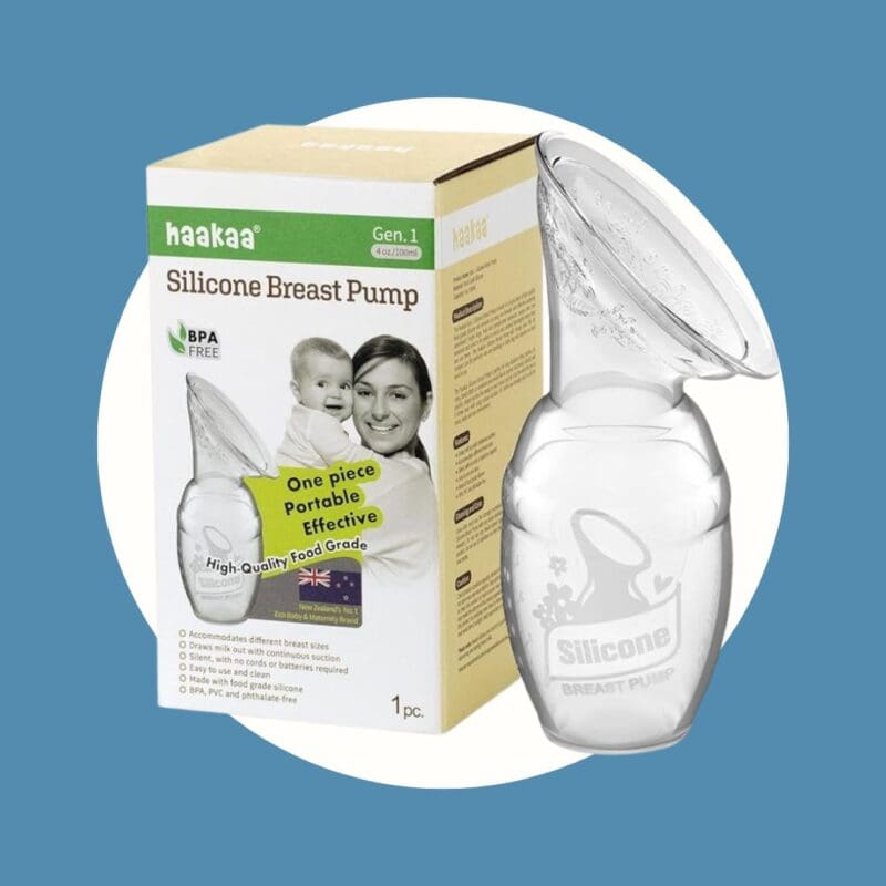 clear breast pump next to a yellow green and white box with woman and child on the front