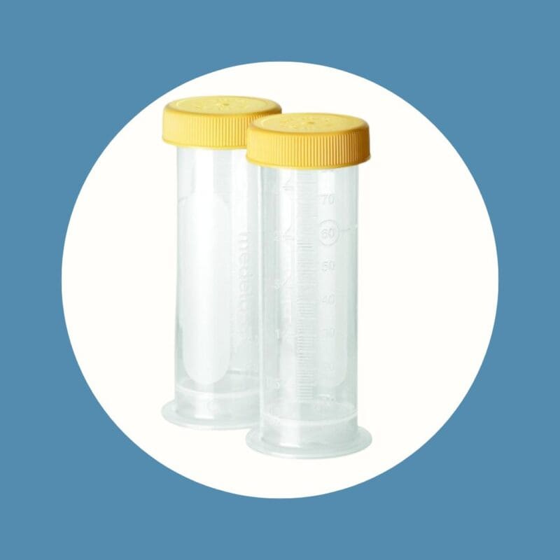 two clear graduated bottles with yellow lids