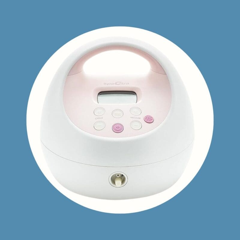 white and pink breast pump