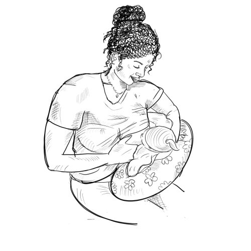 A woman holding her baby in her arms.